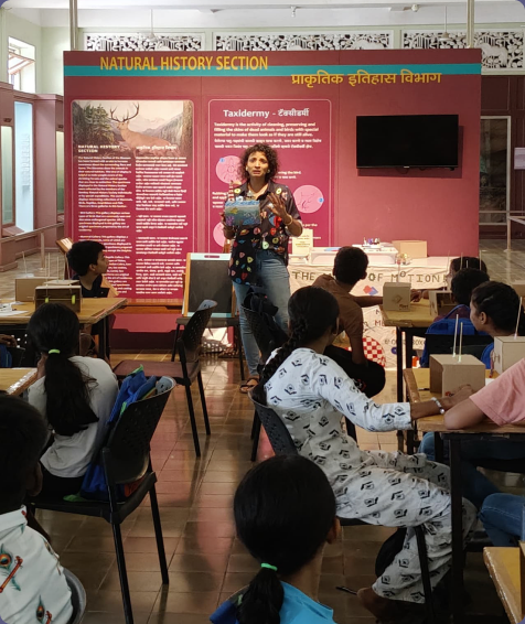 Poornima leading a hands-on Owtofbox workshop in a classroom
