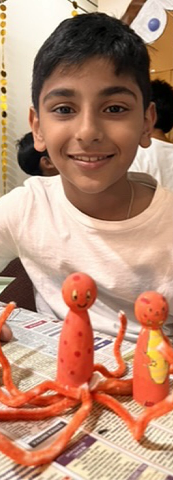 Children at Owtofbox workshops — building, painting and investigating together