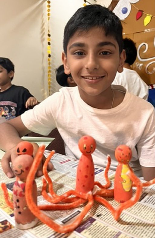 Children at Owtofbox workshops — building, painting and investigating together